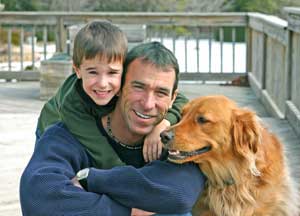 father and son with dog