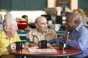 3 senior men in coffee shop