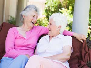 women sitting and laughing